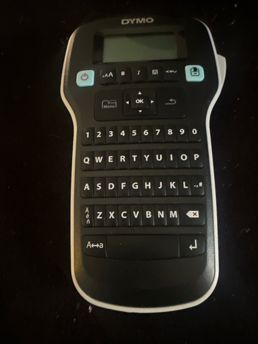 Dymo Handheld Label Maker in Black with White Trim and Light Blue Buttons